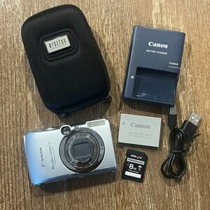 Canon PowerShot Digital ELPH SD890 IS - Case, Cord, Memory Card, Battery WORKING